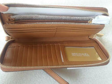 Load image into Gallery viewer, Michael Kors Leather Continental Wristlet Brown (used)
